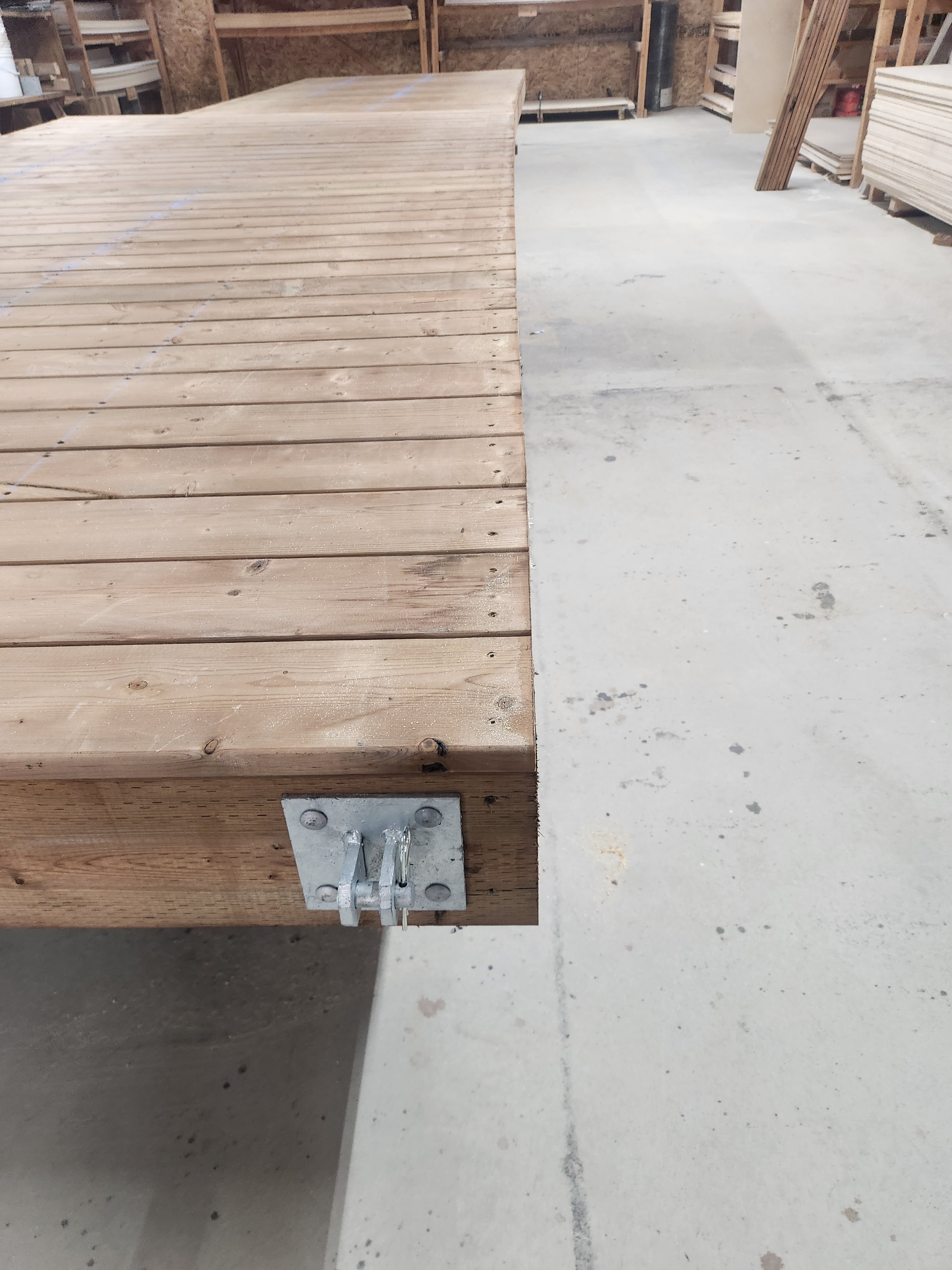 Galvanized dock hardware mounted on a wooden dock frame
